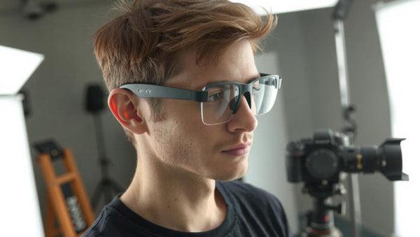 Close-up of a modern man wearing HD camera glasses designed for creators and professionals