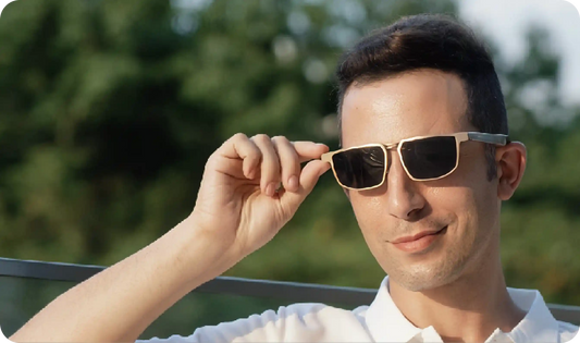 A professional man wearing premium gold-frame smart sunglasses without a camera, featured as a stylish alternative to Ray-Ban Meta in 2026