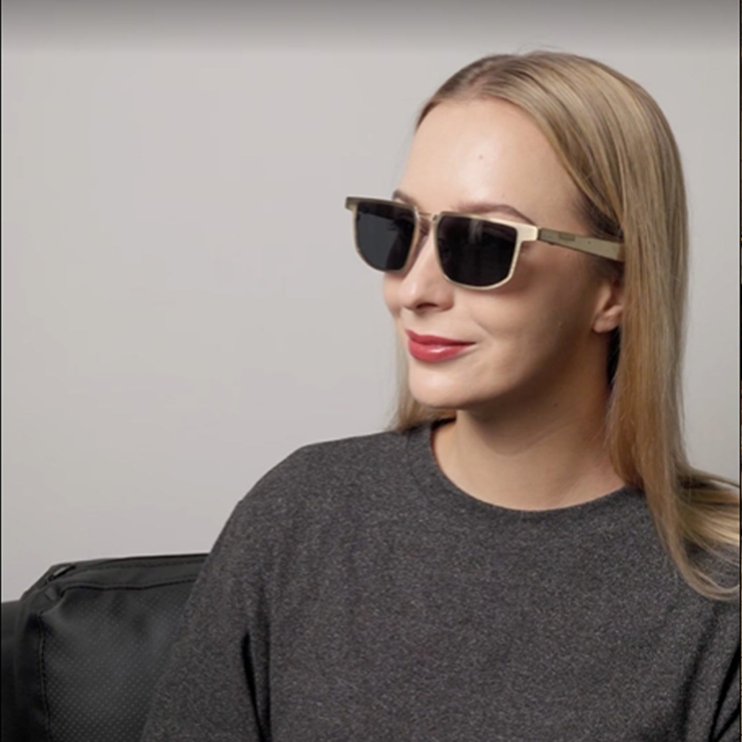 Businesswoman Working In The Office With Dymesty AI Sunglasses Moore Vision. Where Sunlight Meets Insight. Uncompromised Vision.