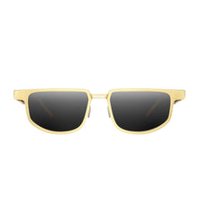Dymesty Moore Vision AI smart sunglasses in gold frame with adaptive lenses