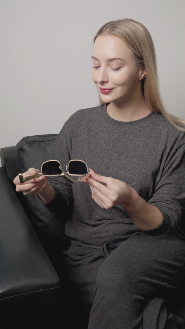 Customer showing Dymesty Moore Vision AI sunglasses in a video review