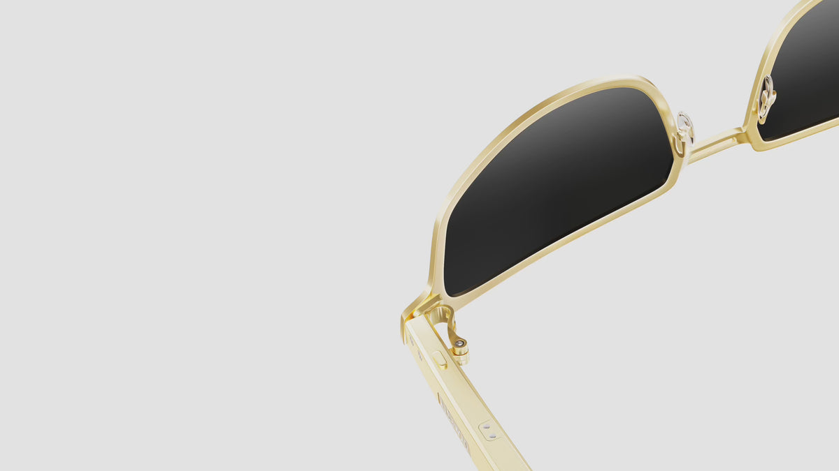Close-up of Dymesty Moore Vision gold titanium AI sunglasses